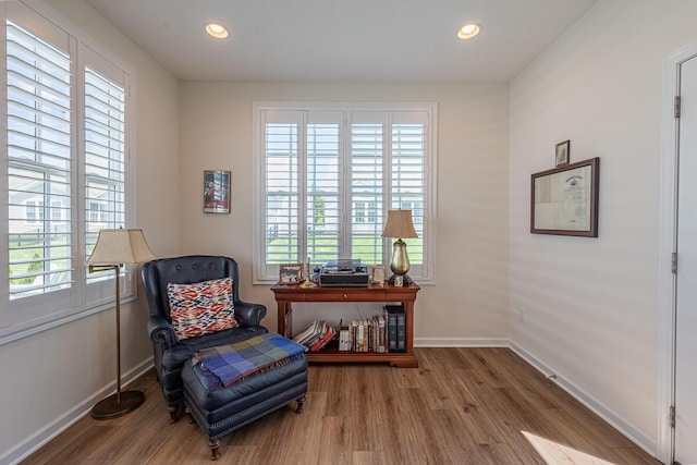 6210 Callaway Sq W, New Albany, OH 43054 - sitting room with plenty of natural light, wood finished floors, baseboards, and recessed lighting