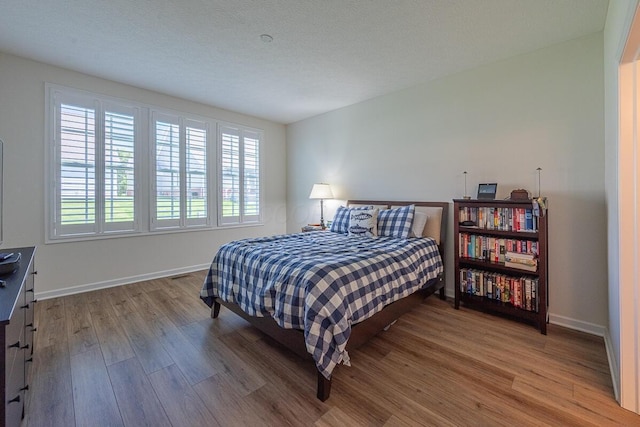6210 Callaway Sq W, New Albany, OH 43054 - bedroom with wood finished floors and baseboards