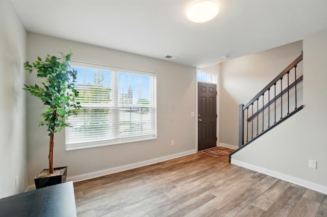 20 N Center St Unit 20, Springfield, OH 45502 - foyer with light wood-style flooring, stairs, and baseboards