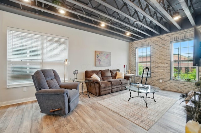 20 N Center St Unit 20, Springfield, OH 45502 - living room with brick wall, hardwood / wood-style flooring, and baseboards