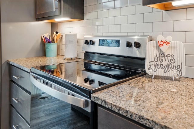 20 N Center St Unit 20, Springfield, OH 45502 - kitchen with stainless steel range with electric stovetop, decorative backsplash, and light stone countertops