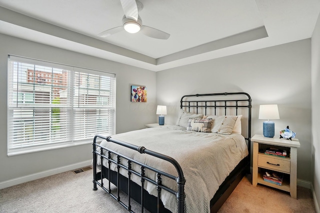 20 N Center St Unit 20, Springfield, OH 45502 - bedroom featuring baseboards, carpet floors, a tray ceiling, and ceiling fan