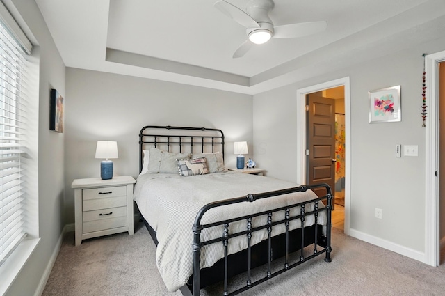 20 N Center St Unit 20, Springfield, OH 45502 - bedroom with light colored carpet, multiple windows, a raised ceiling, and baseboards