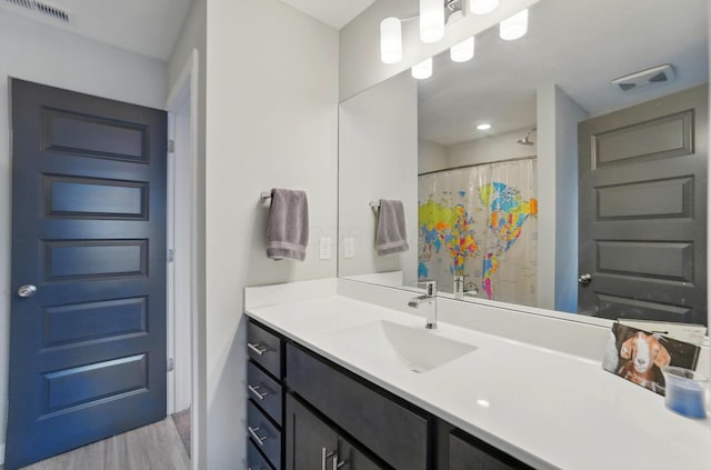20 N Center St Unit 20, Springfield, OH 45502 - full bath featuring wood finished floors, vanity, and a shower with shower curtain