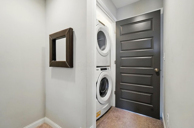 20 N Center St Unit 20, Springfield, OH 45502 - washroom featuring stacked washer and clothes dryer, carpet flooring, and baseboards