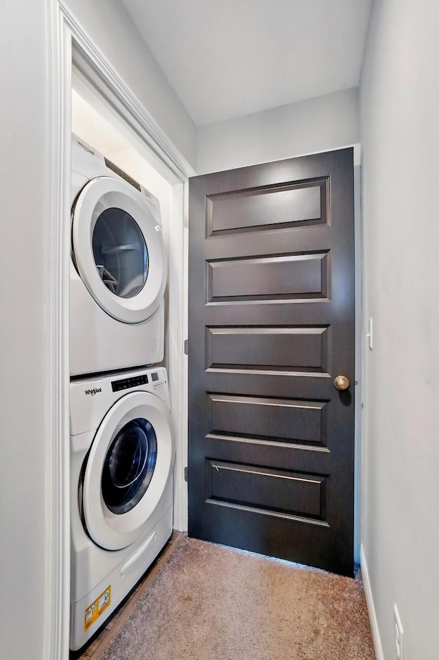 20 N Center St Unit 20, Springfield, OH 45502 - clothes washing area featuring stacked washing machine and dryer and carpet floors