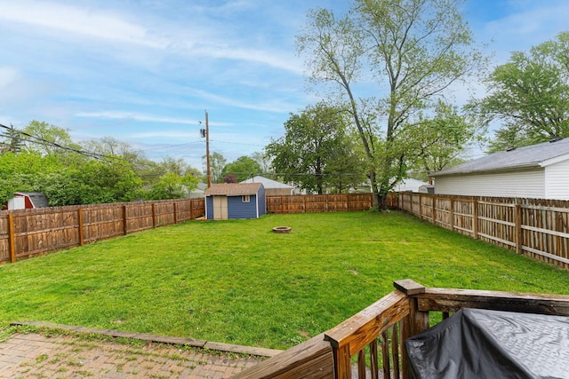view of yard with a storage shed and an outdoor structure