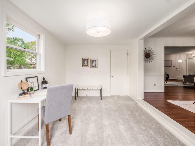 home office with wood finished floors