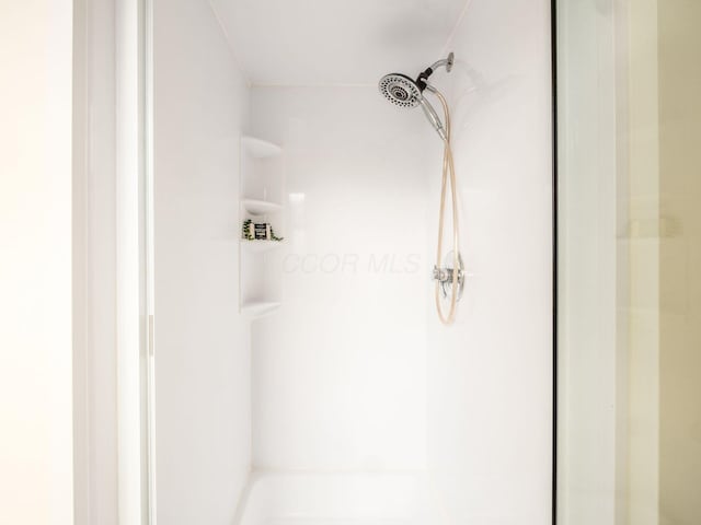 bathroom with a stall shower