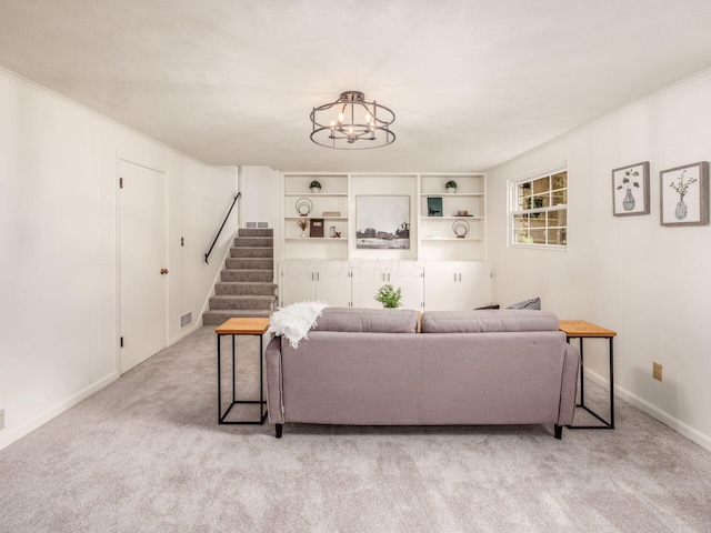 carpeted living area featuring stairs, a chandelier, and baseboards