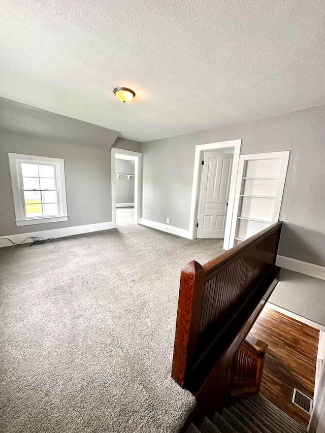 375 N Main St, Marion, OH 43302 - empty room featuring baseboards, a textured ceiling, and carpet flooring