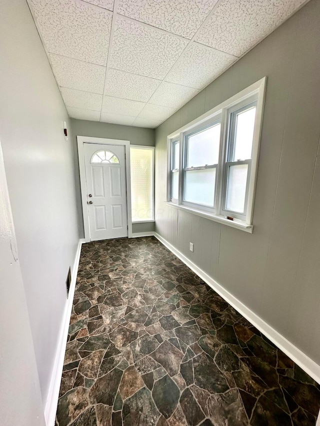 375 N Main St, Marion, OH 43302 - foyer with baseboards, a drop ceiling, and stone floors
