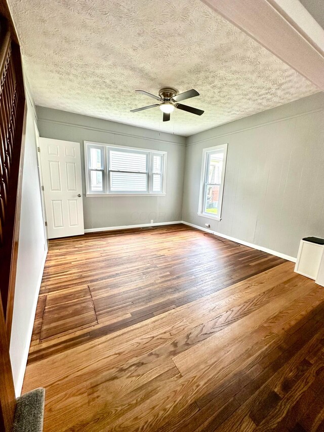 375 N Main St, Marion, OH 43302 - spare room featuring wood finished floors, ceiling fan, a textured ceiling, and baseboards