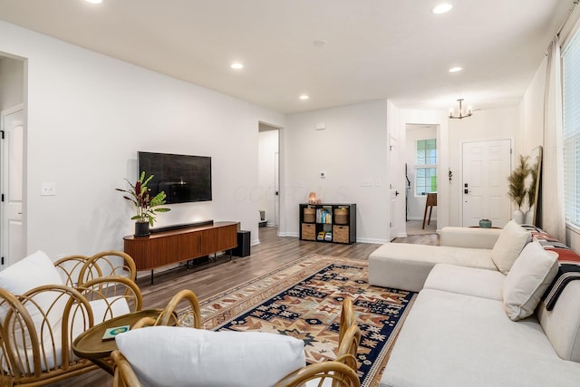 living room with wood finished floors, recessed lighting, and baseboards