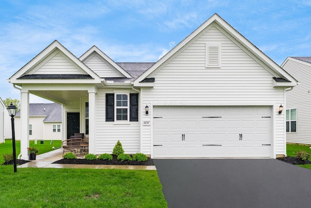 single story home featuring asphalt driveway, a front lawn, a shingled roof, and a garage