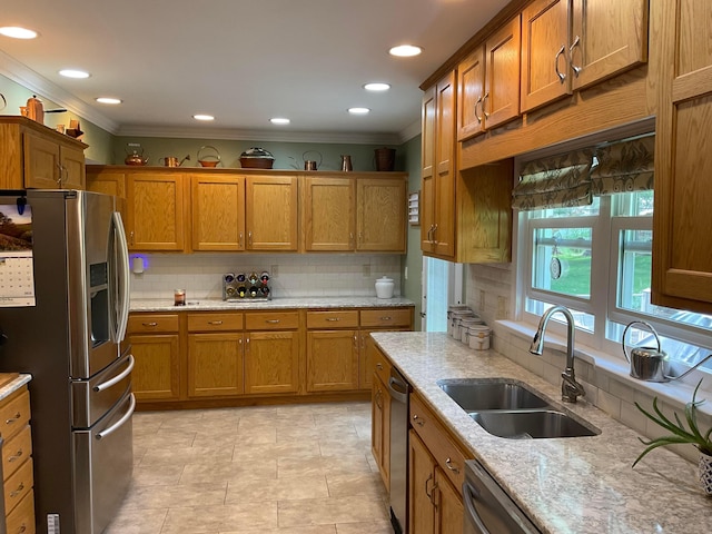 1893 Lovers Ln, New Lexington, OH 43764 - kitchen with stainless steel fridge, a sink, crown molding, brown cabinetry, and tasteful backsplash