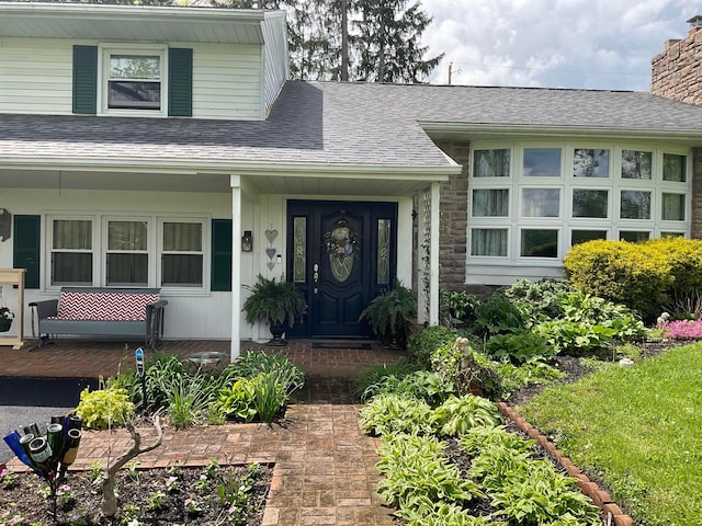 1893 Lovers Ln, New Lexington, OH 43764 - view of exterior entry featuring a porch, a chimney, and a shingled roof