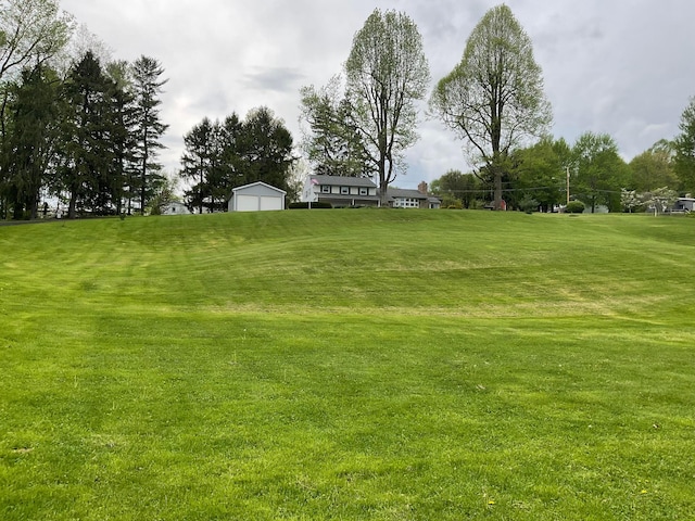 1893 Lovers Ln, New Lexington, OH 43764 - view of grassy yard with a detached garage and an outdoor structure