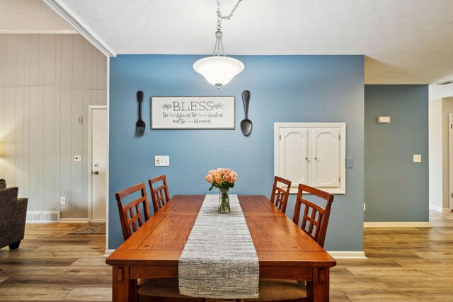 10842 Johnstown Rd, New Albany, OH 43054 - dining area with wood finished floors, baseboards, and stairs