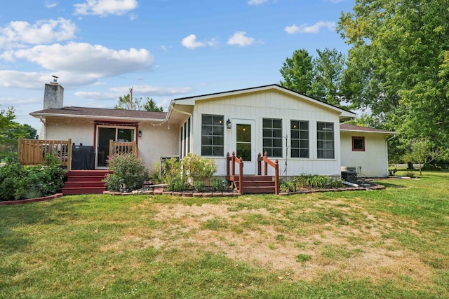 10842 Johnstown Rd, New Albany, OH 43054 - back of property with a yard, a chimney, and a wooden deck