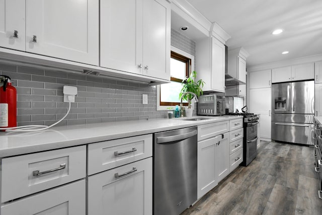10129 Granden St, Pickerington, OH 43147 - kitchen featuring stainless steel appliances, a sink, white cabinetry, light countertops, and decorative backsplash
