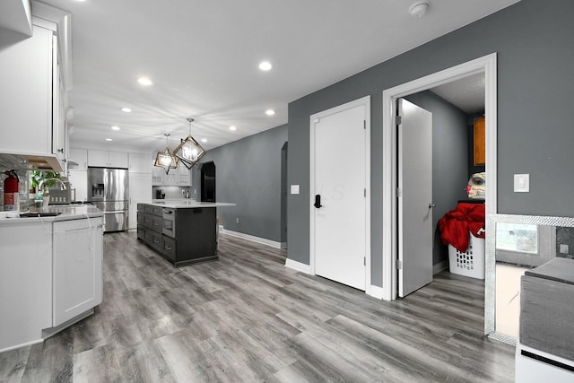 10129 Granden St, Pickerington, OH 43147 - kitchen featuring stainless steel fridge with ice dispenser, light countertops, white cabinets, recessed lighting, and a kitchen island