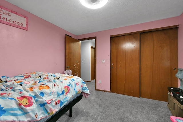 10129 Granden St, Pickerington, OH 43147 - carpeted bedroom with a closet and a textured ceiling