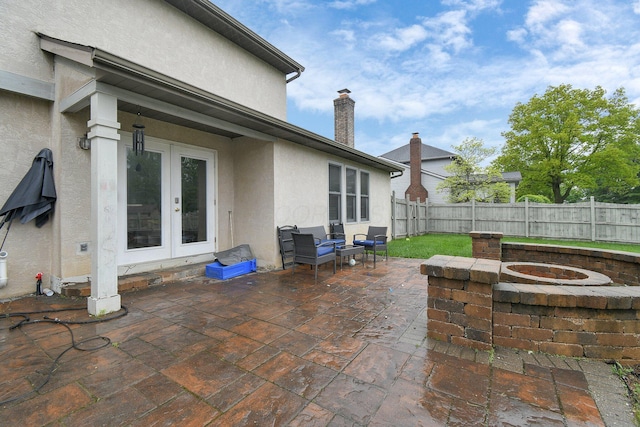 10129 Granden St, Pickerington, OH 43147 - view of patio with a fire pit, french doors, and a fenced backyard