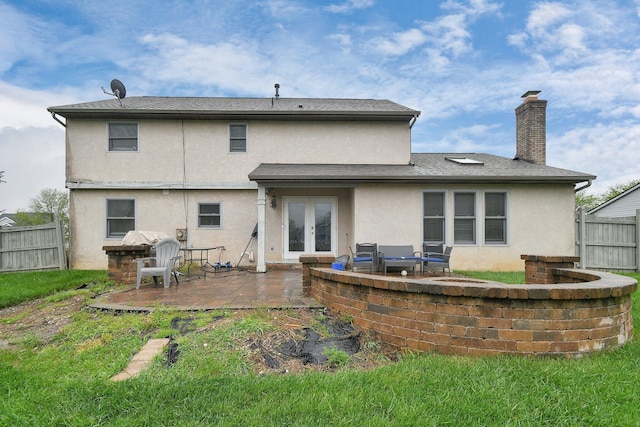 10129 Granden St, Pickerington, OH 43147 - rear view of property with french doors, stucco siding, a patio area, and a fenced backyard