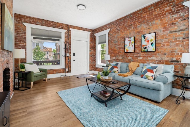 453-455 S 22nd St, Columbus, OH 43205 - living room featuring brick wall and light wood-style flooring