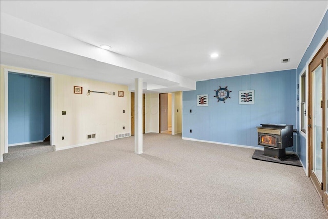 512 Natchez Ln, Sugar Grove, OH 43155 - finished basement featuring a wood stove, carpet floors, and recessed lighting
