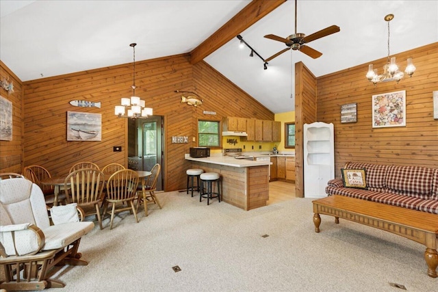 512 Natchez Ln, Sugar Grove, OH 43155 - kitchen with a chandelier, wood walls, ceiling fan, light carpet, and a peninsula