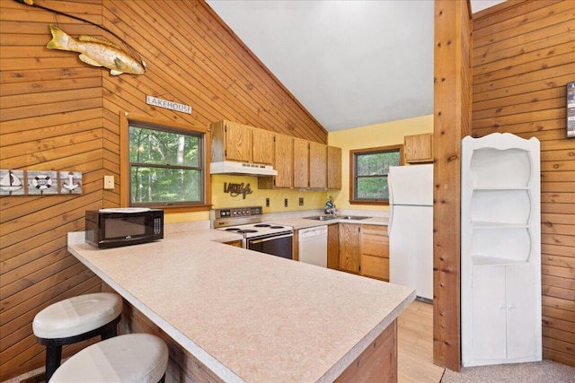 512 Natchez Ln, Sugar Grove, OH 43155 - kitchen featuring white appliances, under cabinet range hood, wooden walls, light countertops, and a peninsula
