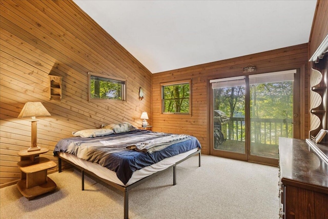 512 Natchez Ln, Sugar Grove, OH 43155 - bedroom featuring access to exterior, carpet floors, wooden walls, and vaulted ceiling