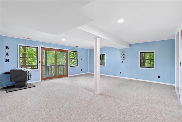 512 Natchez Ln, Sugar Grove, OH 43155 - unfurnished living room with carpet, a wood stove, and recessed lighting