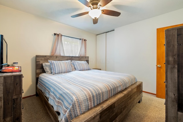 bedroom featuring carpet, baseboards, and a ceiling fan