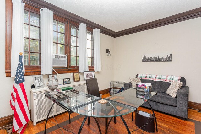 404 Rawling St, Washington Court House, OH 43160 - living room featuring crown molding, baseboards, hardwood / wood-style floors, and healthy amount of natural light