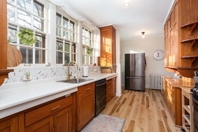 404 Rawling St, Washington Court House, OH 43160 - kitchen featuring a sink, radiator heating unit, black dishwasher, open shelves, and freestanding refrigerator