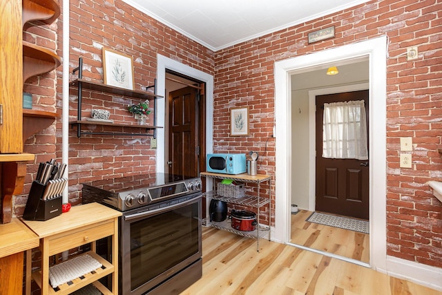 404 Rawling St, Washington Court House, OH 43160 - entryway with wood finished floors, crown molding, and brick wall
