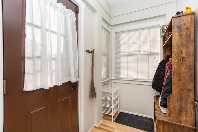 404 Rawling St, Washington Court House, OH 43160 - doorway to outside featuring baseboards and wood finished floors