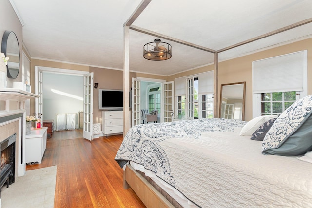 404 Rawling St, Washington Court House, OH 43160 - bedroom with a fireplace, ornamental molding, and wood finished floors