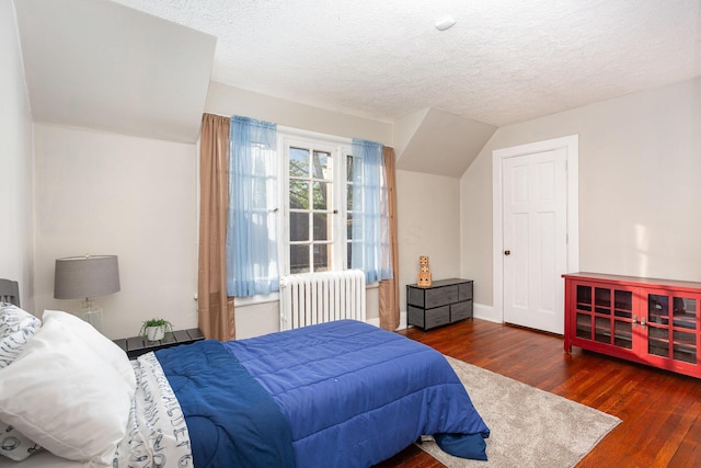 404 Rawling St, Washington Court House, OH 43160 - bedroom featuring radiator, wood finished floors, and a textured ceiling