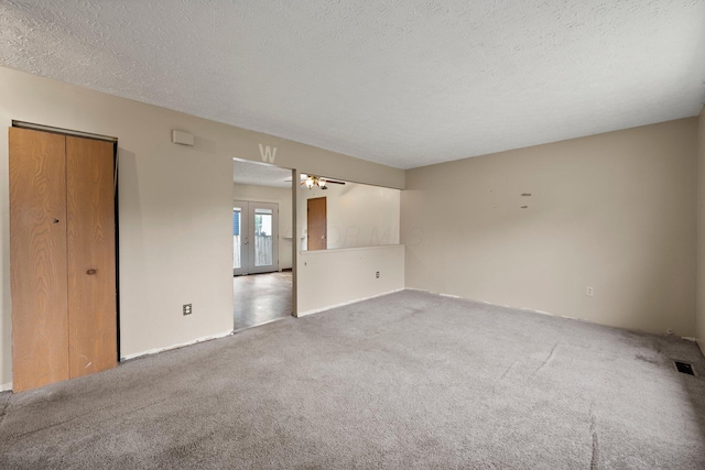 2512 Gantz Rd, Grove City, OH 43123 - carpeted empty room with a textured ceiling and a ceiling fan