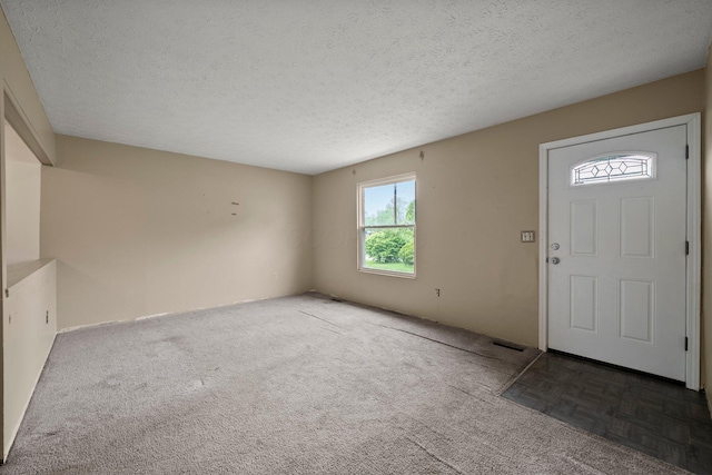 2512 Gantz Rd, Grove City, OH 43123 - carpeted foyer featuring a textured ceiling