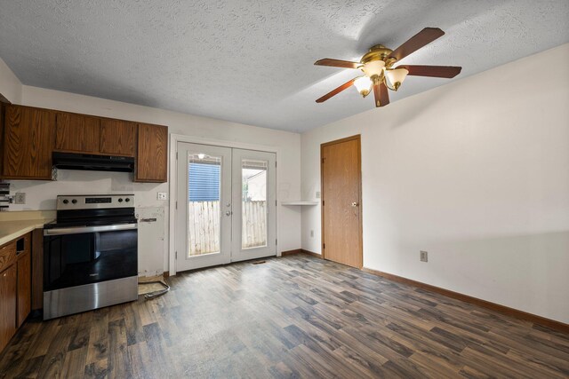 2512 Gantz Rd, Grove City, OH 43123 - kitchen with stainless steel electric range, under cabinet range hood, french doors, dark wood-type flooring, and a textured ceiling