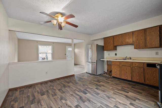 2512 Gantz Rd, Grove City, OH 43123 - kitchen with freestanding refrigerator, a sink, a ceiling fan, light countertops, and dark wood-style floors