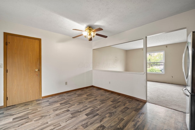 2512 Gantz Rd, Grove City, OH 43123 - unfurnished room featuring ceiling fan, wood finished floors, a textured ceiling, and baseboards