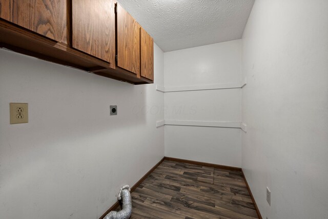 2512 Gantz Rd, Grove City, OH 43123 - clothes washing area with electric dryer hookup, cabinet space, dark wood-style floors, baseboards, and a textured ceiling