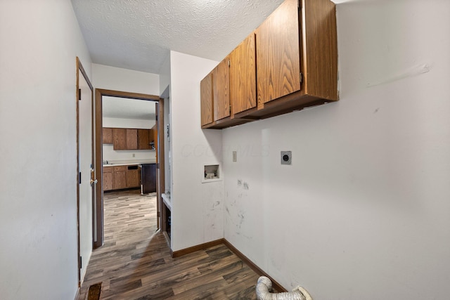 2512 Gantz Rd, Grove City, OH 43123 - laundry area with cabinet space, hookup for an electric dryer, dark wood-style flooring, hookup for a washing machine, and baseboards