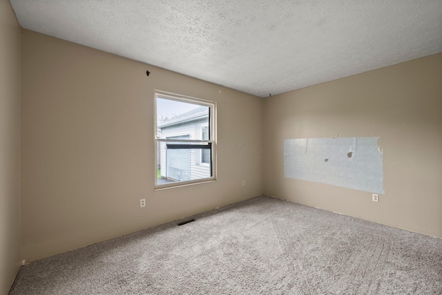 2512 Gantz Rd, Grove City, OH 43123 - spare room featuring carpet and a textured ceiling